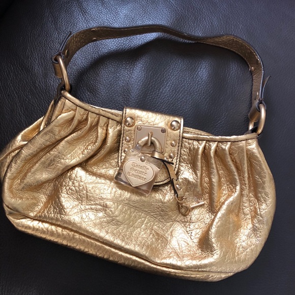 Juicy Couture Handbags - NWOT Gold Juicy Couture Purse